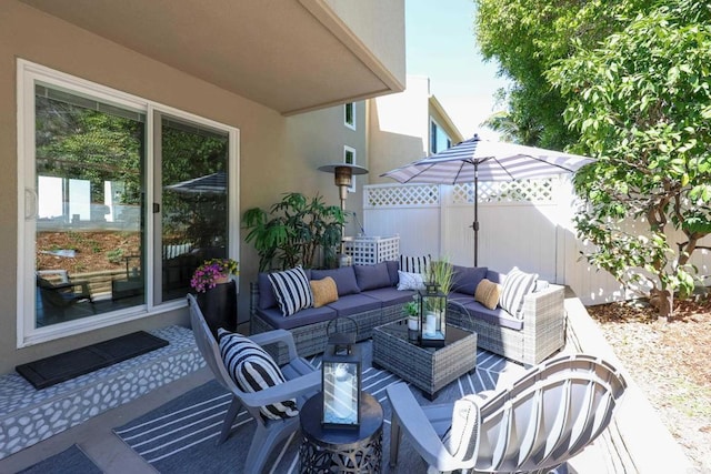 view of patio with fence and an outdoor hangout area