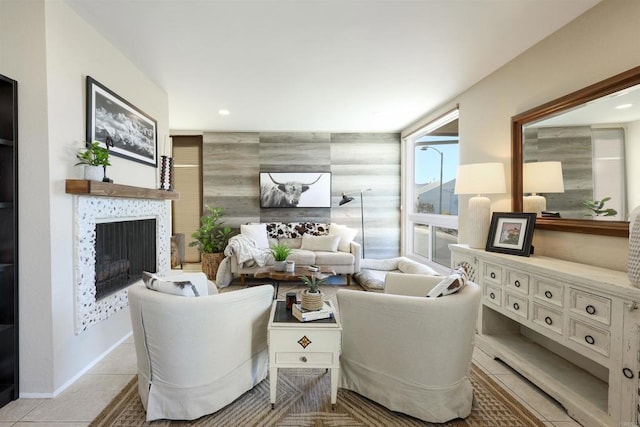 tiled living room with recessed lighting, a fireplace, and baseboards