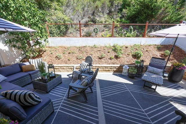 view of patio / terrace with an outdoor hangout area and a fenced backyard