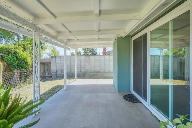 view of patio / terrace featuring fence