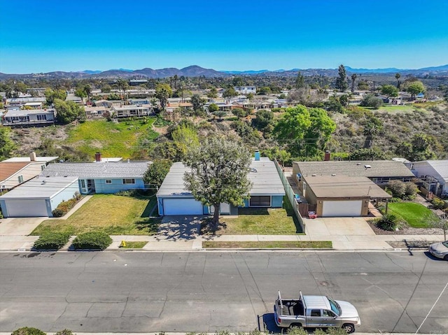 birds eye view of property featuring a mountain view