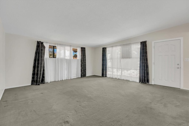 unfurnished room featuring carpet