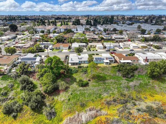 birds eye view of property with a residential view