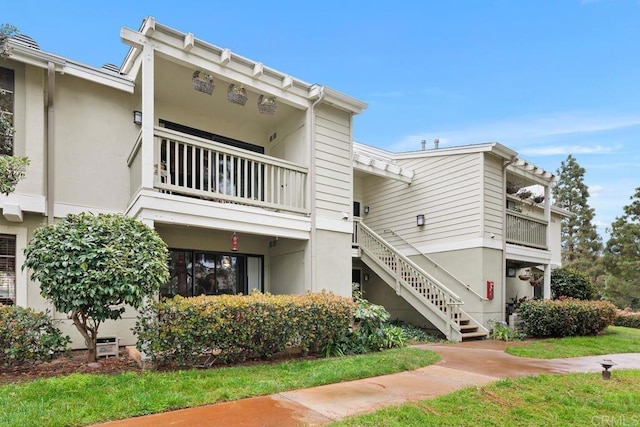 view of property featuring stairway