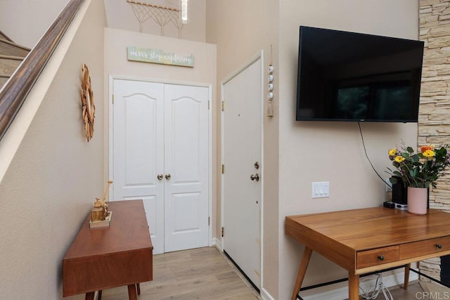 foyer featuring light wood finished floors