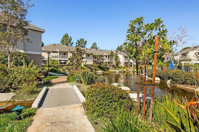 view of property's community featuring a residential view and a water view