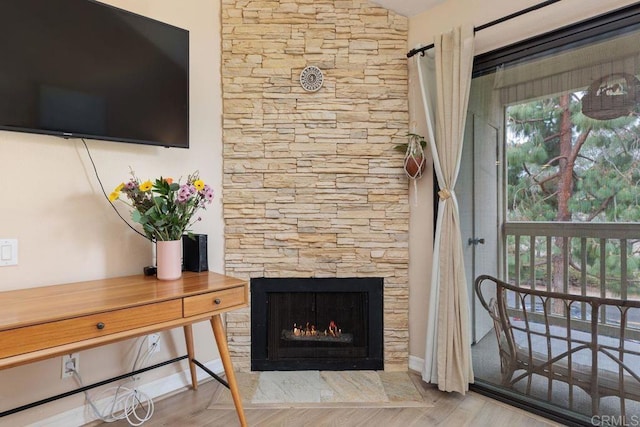 room details featuring a fireplace and wood finished floors