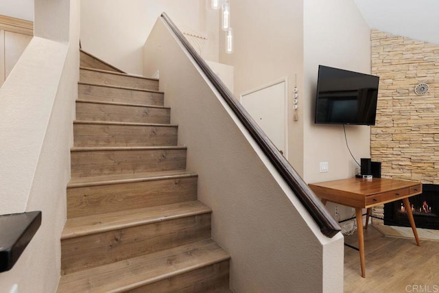 stairs featuring wood finished floors