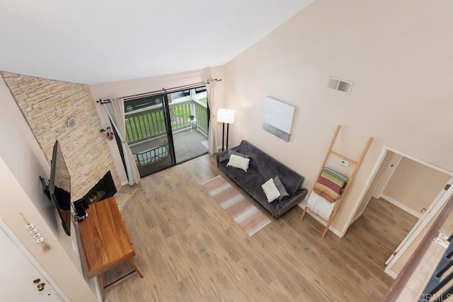 living room with visible vents and light wood-style flooring