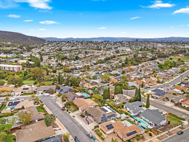 birds eye view of property featuring a mountain view and a residential view