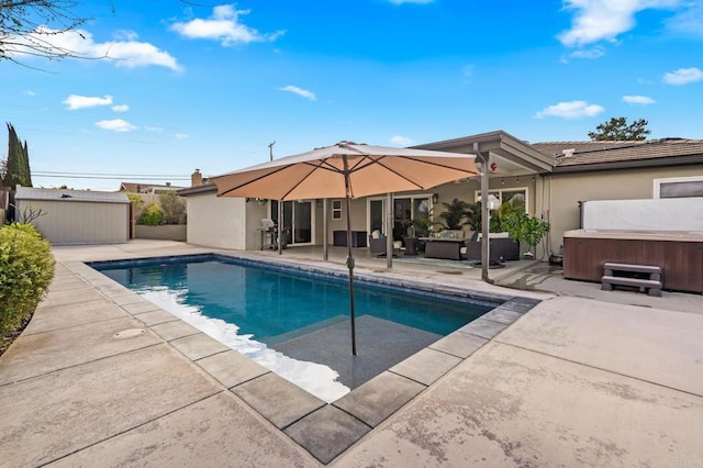 view of swimming pool featuring outdoor lounge area, a patio area, a fenced in pool, and a hot tub