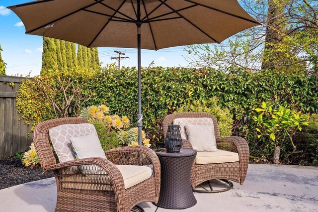 view of patio featuring fence