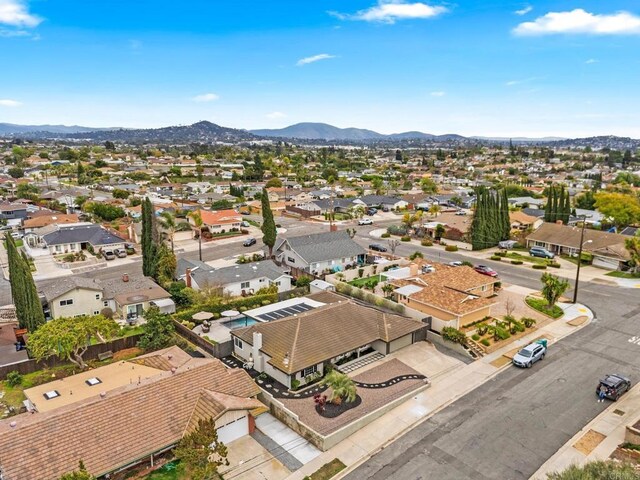 drone / aerial view featuring a mountain view and a residential view