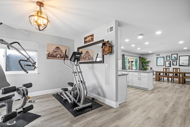 workout room with recessed lighting, baseboards, visible vents, and light wood-type flooring