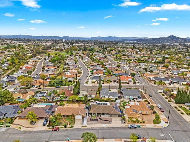 birds eye view of property featuring a mountain view and a residential view