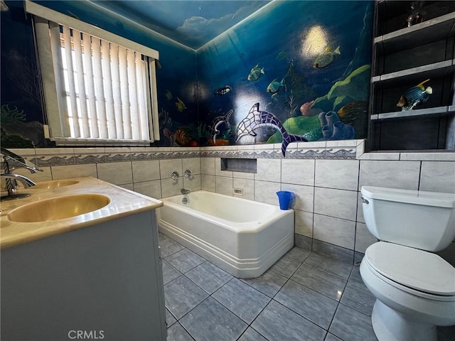 full bathroom with a bath, a sink, tile patterned flooring, tile walls, and toilet