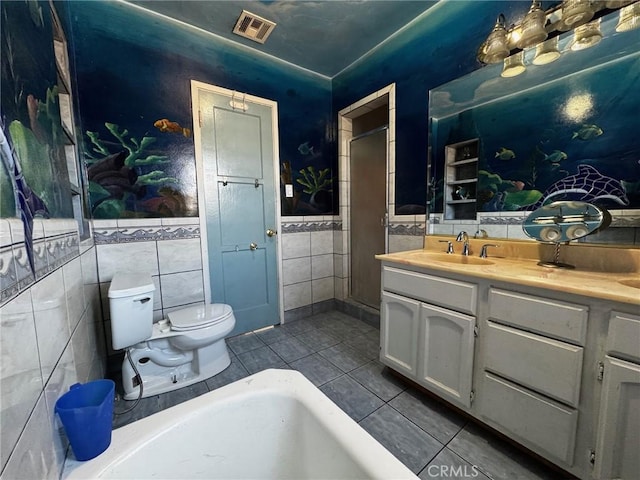 full bath with tile patterned floors, visible vents, toilet, tile walls, and vanity