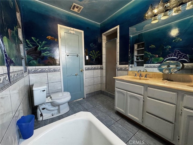 9410 S 4th Ave, Inglewood, CA 90305 - full bathroom featuring tile patterned floors, visible vents, toilet, tile walls, and vanity