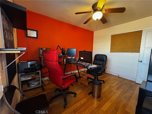 home office with a ceiling fan and wood finished floors