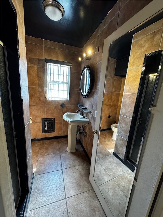 9410 S 4th Ave, Inglewood, CA 90305 - full bath featuring toilet, tile walls, and a shower stall