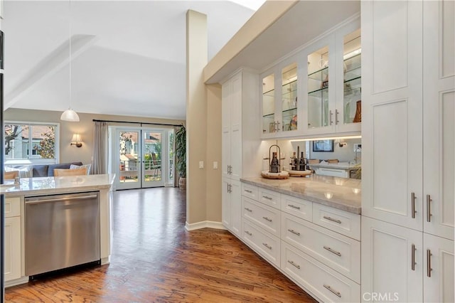 bar featuring baseboards, light wood finished floors, vaulted ceiling, stainless steel dishwasher, and decorative light fixtures