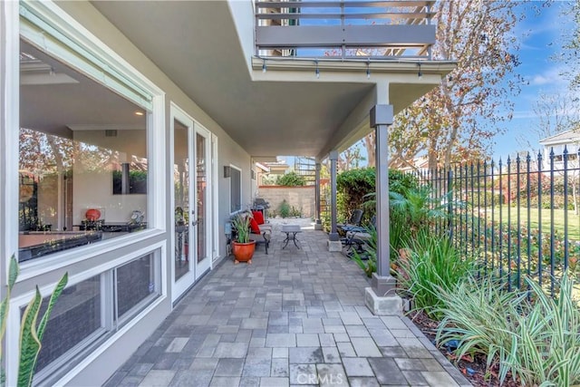 view of patio featuring fence