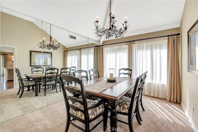 dining room with visible vents, plenty of natural light, light colored carpet, and an inviting chandelier