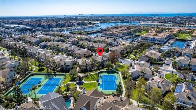 drone / aerial view featuring a residential view and a water view