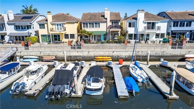 exterior space with a residential view and a water view