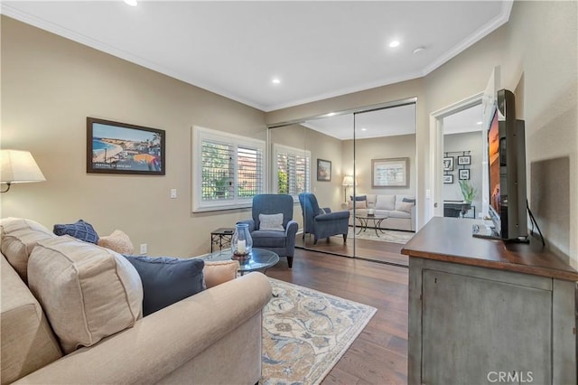 living room with hardwood / wood-style flooring, recessed lighting, and ornamental molding