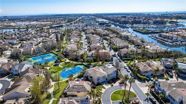 bird's eye view with a residential view and a water view