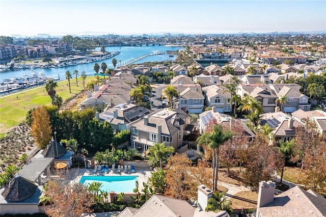 bird's eye view with a water view and a residential view