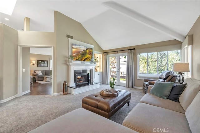 carpeted living area featuring visible vents, a multi sided fireplace, high vaulted ceiling, and baseboards