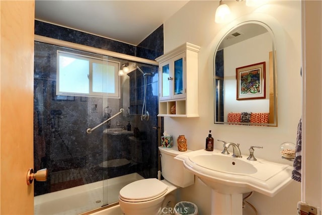 full bathroom with visible vents, toilet, and a shower stall