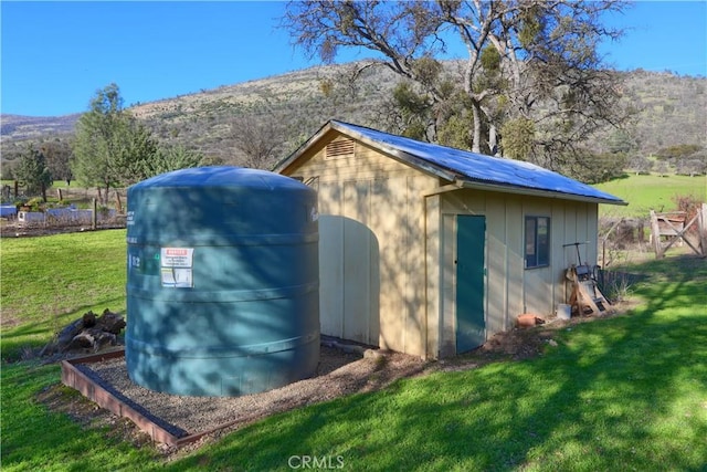 view of outdoor structure featuring a mountain view and an outdoor structure