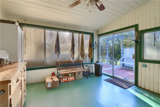 sunroom with a ceiling fan and lofted ceiling