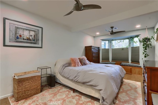 bedroom with recessed lighting, baseboards, wood finished floors, and a ceiling fan