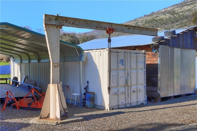 view of outdoor structure with a carport