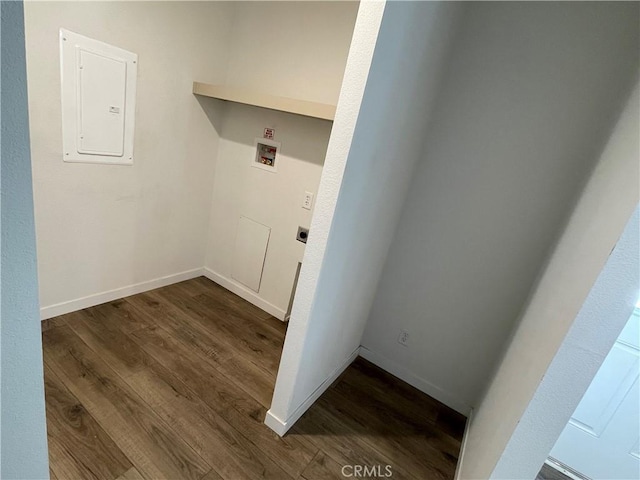 laundry area featuring dark wood-style floors, baseboards, laundry area, electric panel, and washer hookup