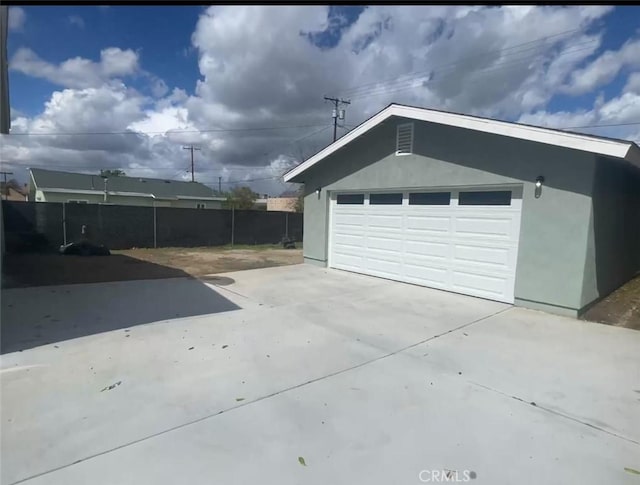 garage featuring fence