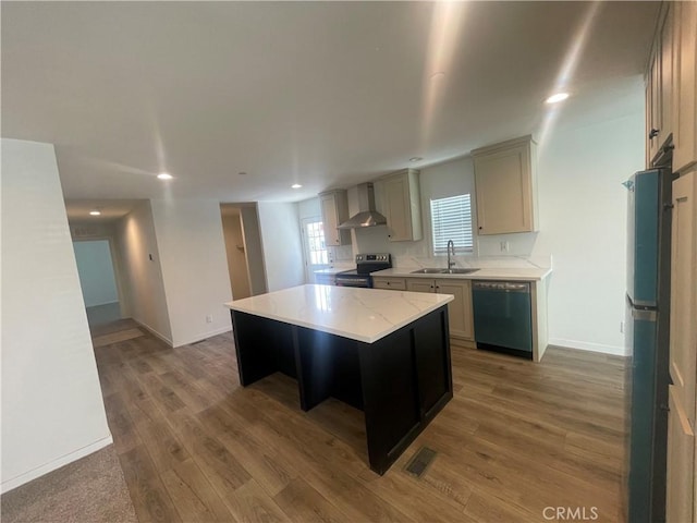 kitchen featuring electric range, freestanding refrigerator, a sink, dishwasher, and wall chimney exhaust hood