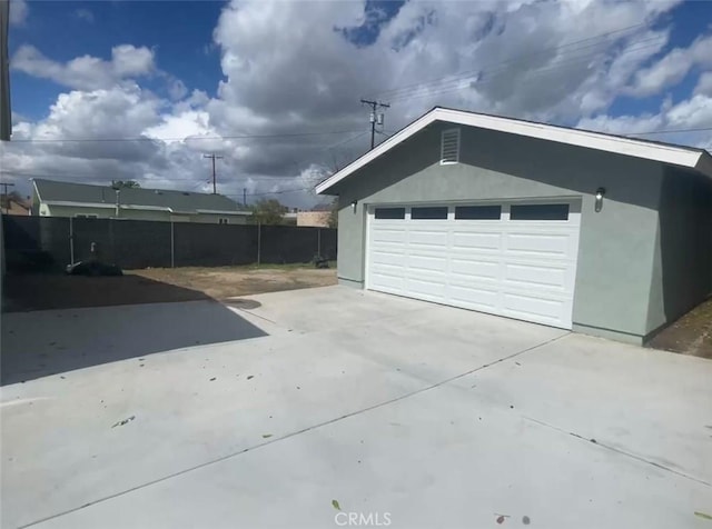 garage with fence