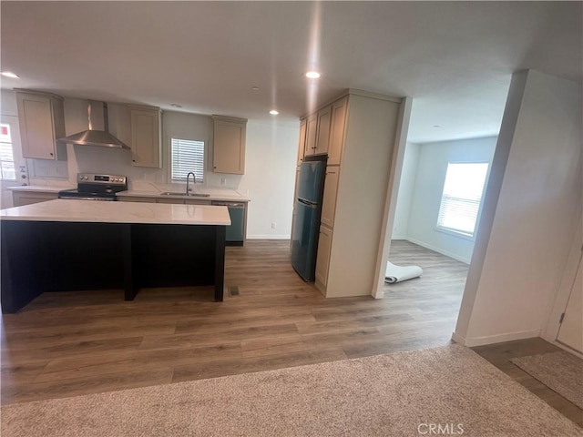 kitchen featuring dishwashing machine, electric range, gray cabinetry, a sink, and wall chimney range hood