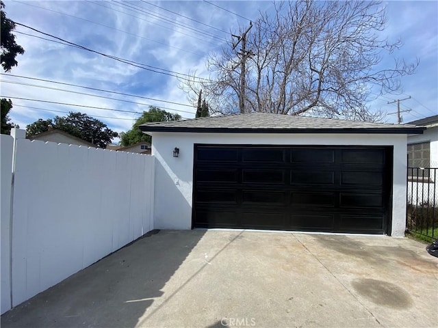 detached garage with fence