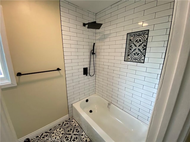 full bath with baseboards, shower / bathtub combination, and tile patterned flooring