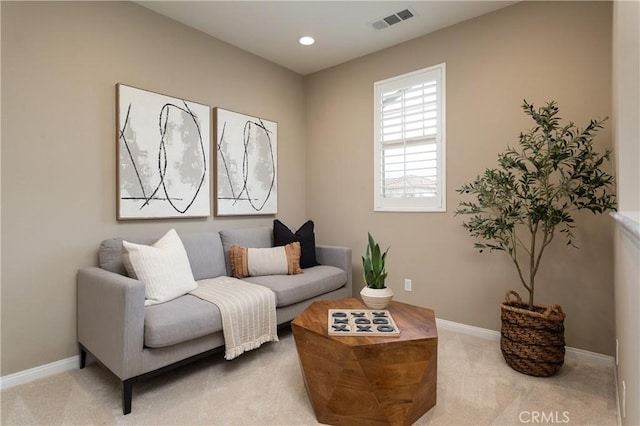 living area with recessed lighting, visible vents, carpet floors, and baseboards