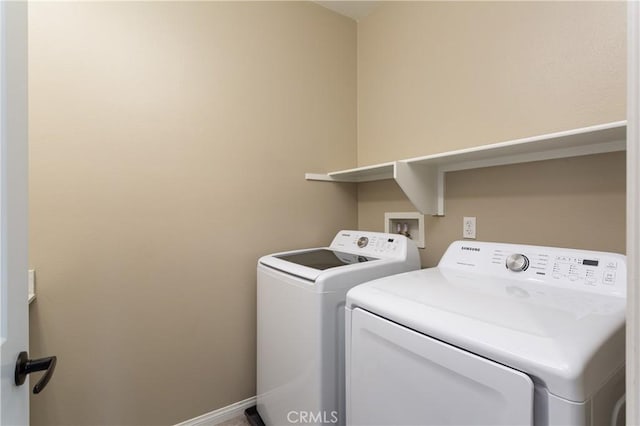 washroom with washer and clothes dryer and laundry area