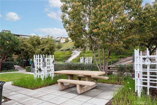 view of property's community featuring a patio area