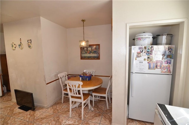 dining area featuring light tile patterned floors