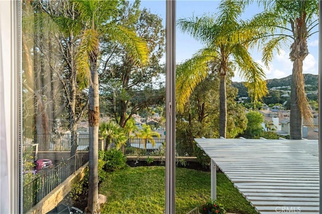 exterior space featuring a mountain view and fence